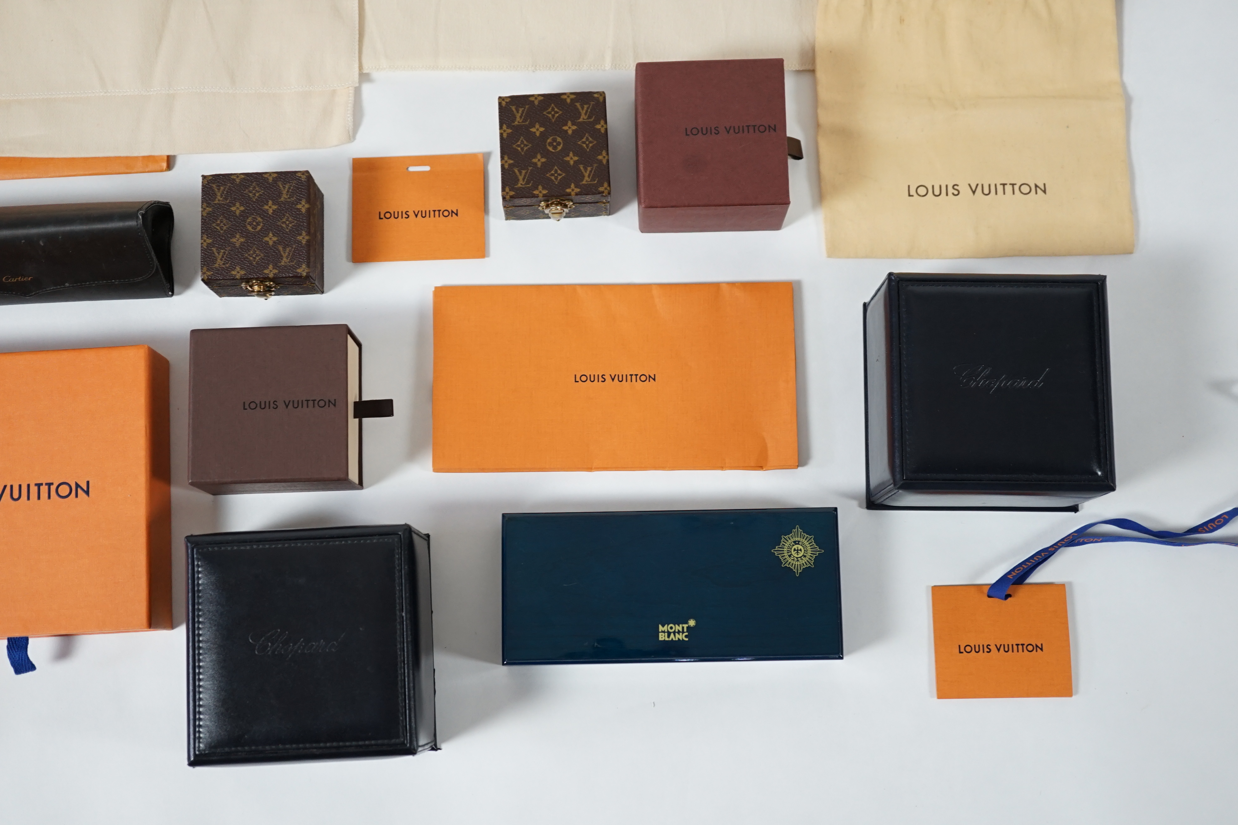 A selection of empty designer boxes including Cartier, Louis Vuitton and Chopard